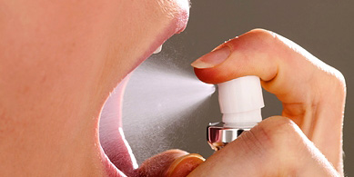 agefoto rm photo of woman using breath spray