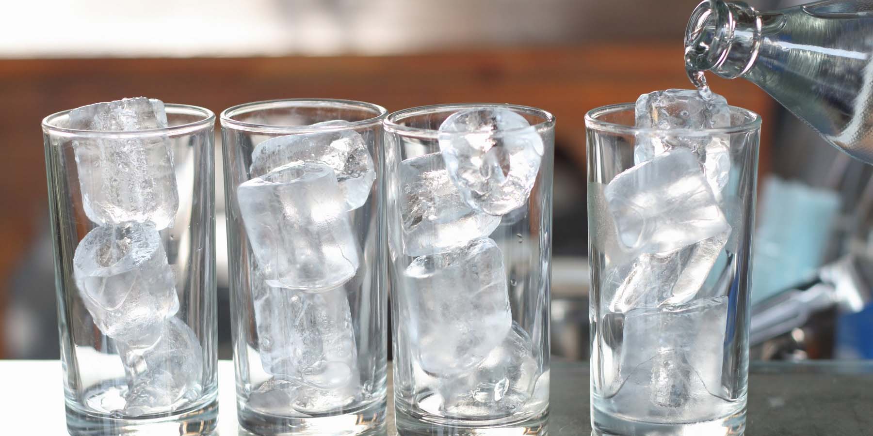 Photo of empty glass with ice cubes