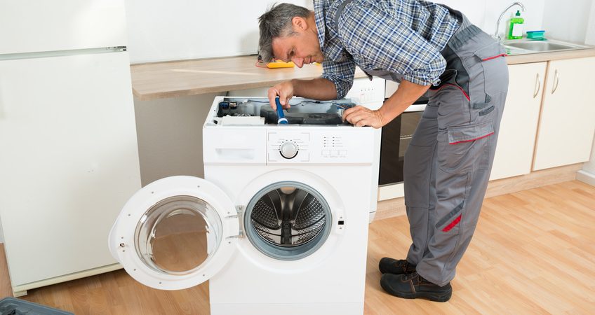 Technician Repairing Washing Machine 848x450 1